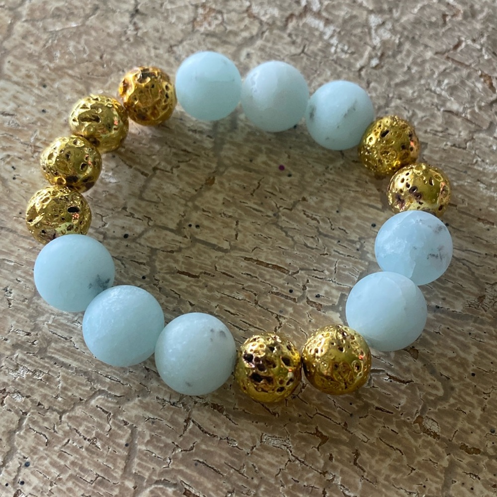 12mm matte blue jade and gold plated lava gemstone bracelet.